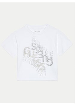 Guess T-Shirt J4BI05 J1314 Biały Boxy Fit ze sklepu MODIVO w kategorii Bluzki dziewczęce - zdjęcie 177877925