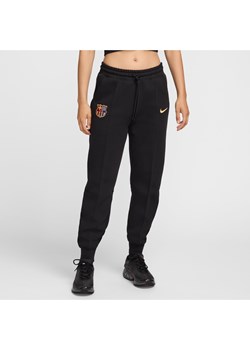 Damskie joggery piłkarskie ze średnim stanem Nike FC Barcelona Tech Fleece - Czerń ze sklepu Nike poland w kategorii Spodnie damskie - zdjęcie 177941039