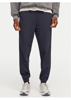 Jack&Jones Spodnie dresowe Morgan 12257964 Granatowy Regular Fit ze sklepu MODIVO w kategorii Spodnie męskie - zdjęcie 178378735