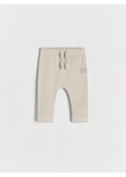 Reserved - Bawełniane spodnie - beżowy ze sklepu Reserved w kategorii Odzież dla niemowląt - zdjęcie 178443355
