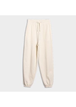 Damskie spodnie dresowe joggery 4F 4FWSS25TTROF0994 - białe ze sklepu Sportstylestory.com w kategorii Spodnie damskie - zdjęcie 178529795