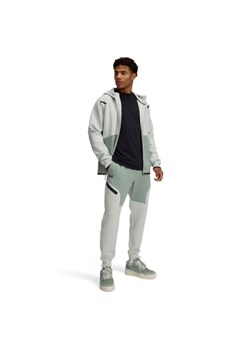 Męskie spodnie treningowe Under Armour UA Unstoppable Flc Jgr Eu - zielone ze sklepu Sportstylestory.com w kategorii Spodnie męskie - zdjęcie 178599069