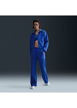 Damskie dopasowane spodnie z dzianiny ze średnim stanem Nike Sportswear Windrunner - Niebieski ze sklepu Nike poland w kategorii Spodnie damskie - zdjęcie 178607189