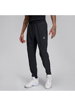 Męskie spodnie z tkaniny Dri-FIT Jordan Sport - Czerń ze sklepu Nike poland w kategorii Spodnie męskie - zdjęcie 178609828