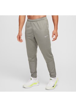 Męskie wodoodporne spodnie do biegania Therma-FIT Nike Sphere Challenger - Szary - id: 38965113464new - marki Nike - 178610026 Męskie wodoodporne spodnie do biegania Therma-FIT Nike Sphere Challenger - Szary ze sklepu Nike poland w kategorii Spodnie męskie - zdjęcie 178610026
