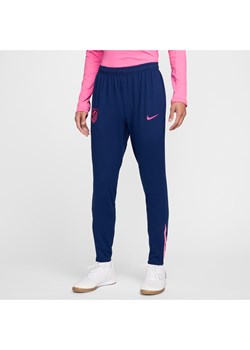 Męskie spodnie piłkarskie Nike Dri-FIT Atlético Madryt Strike (wersja trzecia) - Niebieski ze sklepu Nike poland w kategorii Spodnie męskie - zdjęcie 178610275