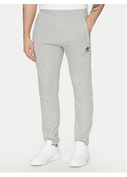 adidas Spodnie dresowe Trefoil Essentials JD2424 Szary Slim Fit ze sklepu MODIVO w kategorii Spodnie męskie - zdjęcie 178690838