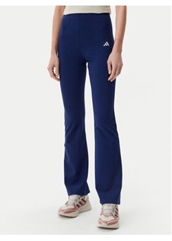 adidas Legginsy Essentials Small Logo JD3073 Granatowy Flare Fit ze sklepu MODIVO w kategorii Spodnie damskie - zdjęcie 178807655