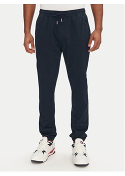 Tommy Jeans Joggery Austin DM0DM20283 Granatowy Slim Fit ze sklepu MODIVO w kategorii Spodnie męskie - zdjęcie 178912247