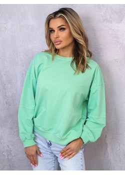 ASYMETRYCZNA BLUZA OVERSIZE Z PRZESZYCIAMI NA RĘKAWACH- ZIELONA ze sklepu olika.com.pl w kategorii Bluzy damskie - zdjęcie 178957619