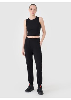 Damskie spodnie dresowe joggery 4F 4FRSS25TTROF1398 - czarne ze sklepu Sportstylestory.com w kategorii Spodnie damskie - zdjęcie 179397017