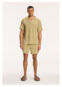 SHIWI Koszulka polo w kolorze beżowym ze sklepu Limango Polska w kategorii T-shirty męskie - zdjęcie 179789237