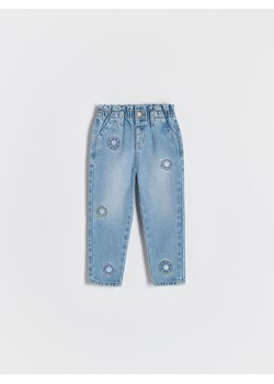 Reserved - Jeansy z haftem SmileyWorld® - niebieski ze sklepu Reserved w kategorii Spodnie dziewczęce - zdjęcie 180362228