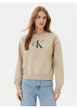 Calvin Klein Jeans Bluza LV047B234G Beżowy Relaxed Fit ze sklepu MODIVO w kategorii Bluzy damskie - zdjęcie 180399639