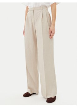 Tommy Hilfiger Spodnie materiałowe WW0WW45460 Beżowy Relaxed Fit ze sklepu MODIVO w kategorii Spodnie damskie - zdjęcie 180404385