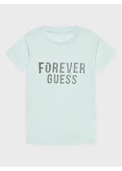 Guess T-Shirt K3RI05 K6YW3 Niebieski Regular Fit ze sklepu MODIVO w kategorii Bluzki dziewczęce - zdjęcie 181033937