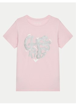 Guess T-Shirt K5RI02 K6YW4 Różowy Regular Fit ze sklepu MODIVO w kategorii Bluzki dziewczęce - zdjęcie 181034969