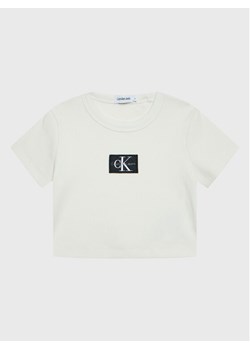 Calvin Klein Jeans T-Shirt Monogram IG0IG01570 Beżowy Regular Fit - id: 0000300636107 - marki Calvin Klein - 181041869 Calvin Klein Jeans T-Shirt Monogram IG0IG01570 Beżowy Regular Fit ze sklepu MODIVO w kategorii T-shirty chłopięce - zdjęcie 181041869