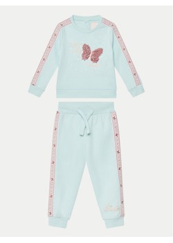 Guess Komplet bluzka i spodnie A5RG19 KA6R4 Niebieski Regular Fit ze sklepu MODIVO w kategorii Komplety niemowlęce - zdjęcie 181042425