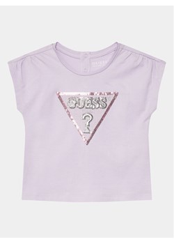 Guess T-Shirt K4GI11 K6YW4 Fioletowy Regular Fit ze sklepu MODIVO w kategorii Bluzki dziewczęce - zdjęcie 181042749
