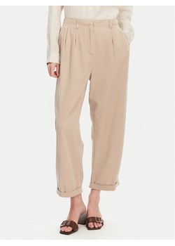 Tommy Hilfiger Spodnie materiałowe WW0WW45589 Beżowy Relaxed Fit ze sklepu MODIVO w kategorii Spodnie damskie - zdjęcie 181046336