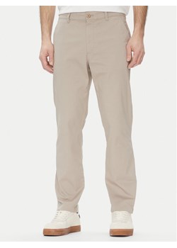 Calvin Klein Jeans Chinosy LV040EM628 Beżowy Slim Fit ze sklepu MODIVO w kategorii Spodnie męskie - zdjęcie 181046745