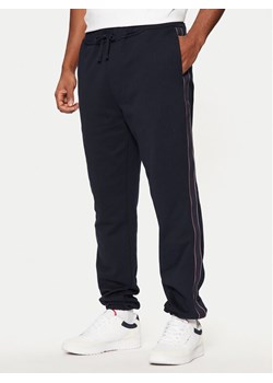 Tommy Hilfiger Spodnie dresowe MW0MW37477 Granatowy Regular Fit ze sklepu MODIVO w kategorii Spodnie męskie - zdjęcie 181047835