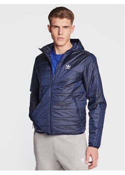 adidas Kurtka przejściowa Padded Hooded Puffer Jacket HL9210 Niebieski Regular Fit ze sklepu MODIVO w kategorii Kurtki męskie - zdjęcie 181050527
