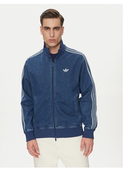 adidas Kurtka jeansowa adicolor Denim Firebird JC6233 Niebieski Loose Fit ze sklepu MODIVO w kategorii Kurtki męskie - zdjęcie 181053368