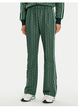 Lacoste Spodnie dresowe XF9313 Zielony Regular Fit ze sklepu MODIVO w kategorii Spodnie damskie - zdjęcie 181054399