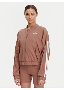 adidas Kurtka bomber Essentials 3-Stripes JD5318 Różowy Loose Fit ze sklepu MODIVO w kategorii Kurtki damskie - zdjęcie 181055499
