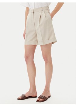 Tommy Hilfiger Szorty materiałowe WW0WW44767 Beżowy Regular Fit ze sklepu MODIVO w kategorii Szorty - zdjęcie 181055889