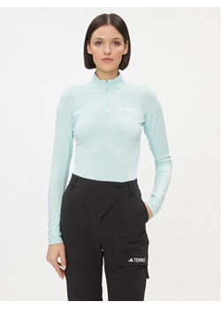 adidas Koszulka techniczna IB1909 Niebieski Slim Fit ze sklepu MODIVO w kategorii Bluzki damskie - zdjęcie 181059198