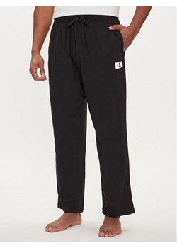 Calvin Klein Underwear Spodnie piżamowe 000NM2611E Czarny Regular Fit ze sklepu MODIVO w kategorii Piżamy męskie - zdjęcie 181060766