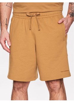 New Balance Szorty sportowe Athletics MS23550 Pomarańczowy Relaxed Fit ze sklepu MODIVO w kategorii Spodenki męskie - zdjęcie 181060885