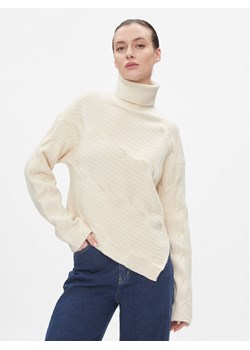 Calvin Klein Sweter Asymetric Modern Cable Sweater K20K206016 Beżowy Regular Fit ze sklepu MODIVO w kategorii Swetry damskie - zdjęcie 181062978