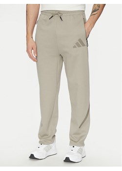 adidas Spodnie dresowe Z.N.E. Open-Hem JC6716 Beżowy Loose Fit - id: 0000304504426 - marki adidas - 181063407 adidas Spodnie dresowe Z.N.E. Open-Hem JC6716 Beżowy Loose Fit ze sklepu MODIVO w kategorii Spodnie męskie - zdjęcie 181063407