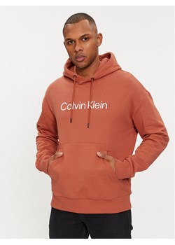 Calvin Klein Bluza Hero K10K111345 Pomarańczowy Relaxed Fit ze sklepu MODIVO w kategorii Bluzy męskie - zdjęcie 181063668