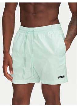 Calvin Klein Swimwear Szorty kąpielowe KM0KM01111 Zielony Regular Fit ze sklepu MODIVO w kategorii Kąpielówki - zdjęcie 181064666