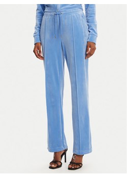 Juicy Couture Spodnie dresowe Tina JCAPW045 Niebieski Regular Fit ze sklepu MODIVO w kategorii Spodnie damskie - zdjęcie 181064899