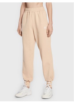 adidas Spodnie dresowe Always Original Laced HK5065 Beżowy Regular Fit ze sklepu MODIVO w kategorii Spodnie damskie - zdjęcie 181067406