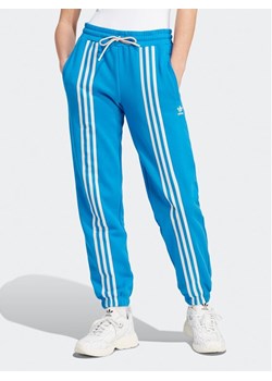 adidas Spodnie dresowe IK7852 Niebieski ze sklepu MODIVO w kategorii Spodnie damskie - zdjęcie 181067736