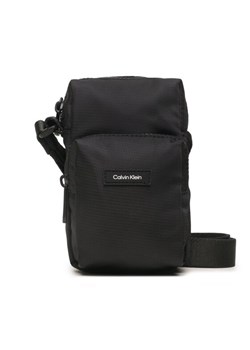 Calvin Klein Saszetka Ck Must T Reporter Xs K50K510570 Czarny ze sklepu MODIVO w kategorii Saszetki - zdjęcie 181067778