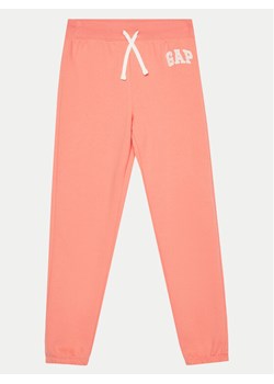 Gap Spodnie dresowe 885882-00 Różowy Relaxed Fit ze sklepu MODIVO w kategorii Spodnie dziewczęce - zdjęcie 181068666