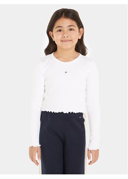 Tommy Hilfiger Bluzka Essential KG0KG07595 Biały Regular Fit ze sklepu MODIVO w kategorii Bluzki dziewczęce - zdjęcie 181068696