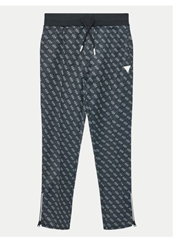 Guess Spodnie dresowe L4YQ18 FL04Q Czarny Relaxed Fit ze sklepu MODIVO w kategorii Spodnie chłopięce - zdjęcie 181068819