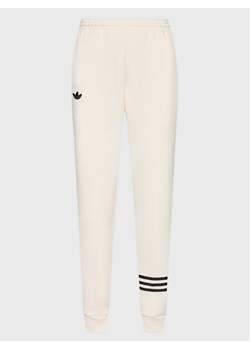 adidas Spodnie dresowe Joggers IB7320 Écru Loose Fit ze sklepu MODIVO w kategorii Spodnie damskie - zdjęcie 181069718