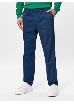 United Colors Of Benetton Spodnie materiałowe 4UN4UF01N Niebieski Slim Fit ze sklepu MODIVO w kategorii Spodnie męskie - zdjęcie 181070769