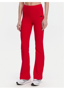 adidas Legginsy Essentials Small Logo JD3074 Czerwony Flare Fit ze sklepu MODIVO w kategorii Spodnie damskie - zdjęcie 181071326