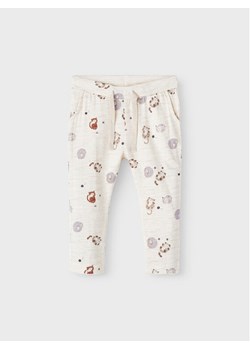 NAME IT Spodnie dresowe 13210042 Żółty Regular Fit ze sklepu MODIVO w kategorii Spodnie i półśpiochy - zdjęcie 181073619